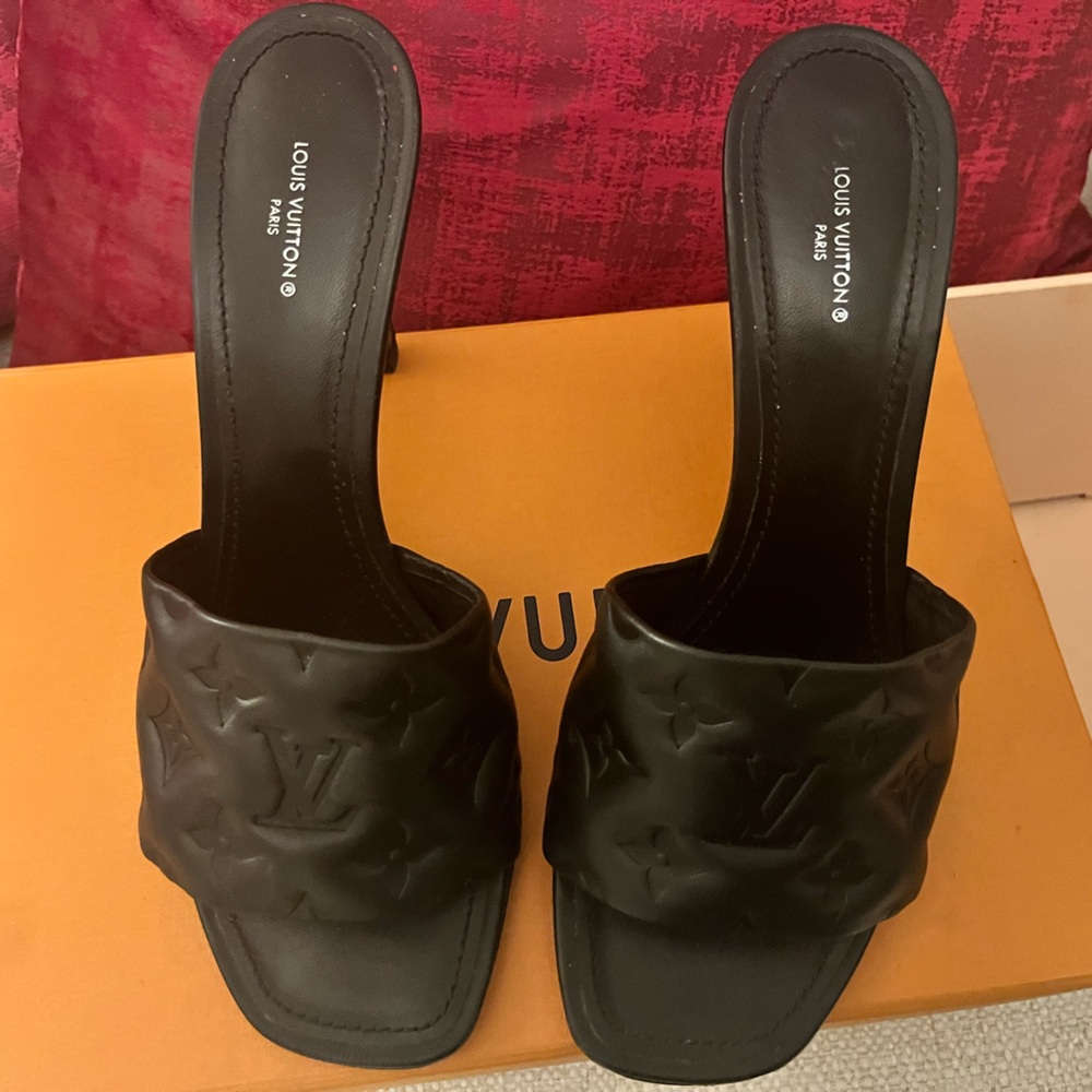Louis Vuitton slides heels embossed black leather. Gently worn